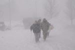 Spc. Daniel Kelly of the Massachusetts Army National Guard's 1058th Transportation Company helps an elderly woman from a transportation vehicle to a shelter during Winter Storm Juno on Jan. 27, 2015 in Weymouth, Massachusetts. About 500 National Guardsmen were activated to assist in relief missions around the state during the storm.
 