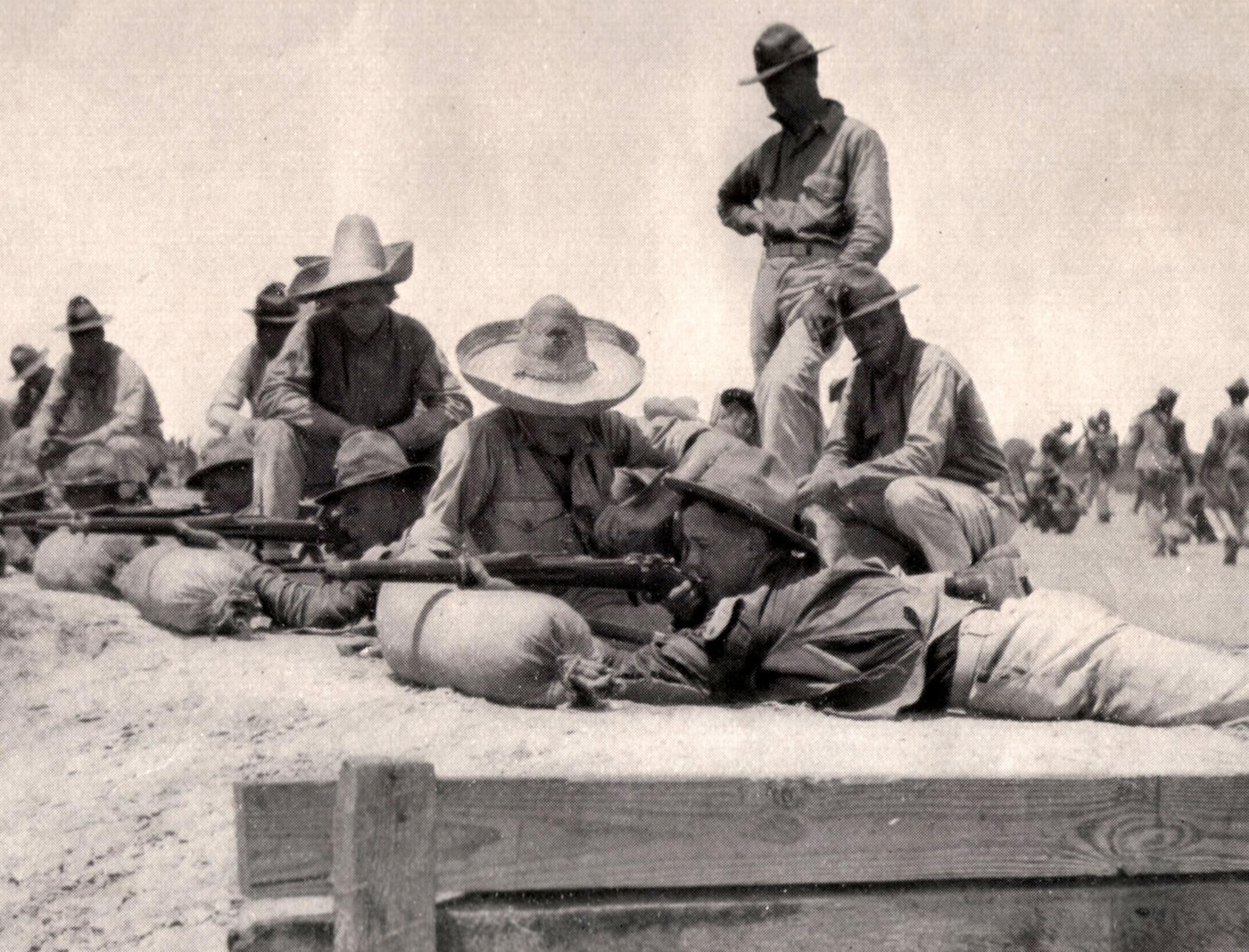 By the sixth or seventh training week recruits marched to their rifle range quarters where they lived for several weeks. On the range, recruits "snapped in," or dry-fired, until live ammunition was used. The object of the training was to qualify each man with the Model 1903 Springfield rifle as a marksman, sharpshooter or expert. The course included timed and untimed firing from the 200, 300 and 500 yard lines in the prone, sitting, standing and kneeling positions. A perfect score was 300 points. The expert medal could be won with 252 points, the sharpshooter with 237, and 201 points were required to become a marksman. Depending on his score, two, three or five extra dollars was added to one's monthly pay.