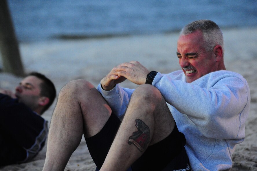 A visiting chief from Pennsylvania performs sit-ups for the 2015 AFSOC Chiefs Orientation at Hurlburt Field, Fla., Jan. 27, 2015. The Air Force selected 479 senior master sergeants for promotion to chief master sergeant in 2014. (U.S. Air Force photo/Airman 1st Class Andrea Posey)