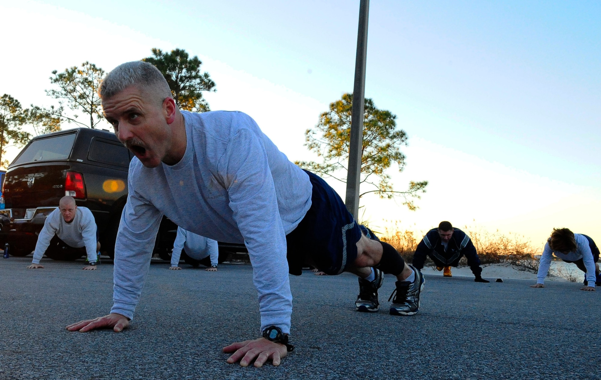 Chief Master Sgt. Bruce Dixon, 24th Special Operations Wing command chief, performs memorial push-ups after a workout for the 2015 AFSOC Chiefs Orientation at Hurlburt Field, Fla., Jan. 27, 2015. Only  one percent of the enlisted force reaches the rank of chief master sergeant. (U.S. Air Force photo/Airman 1st Class Andrea Posey)