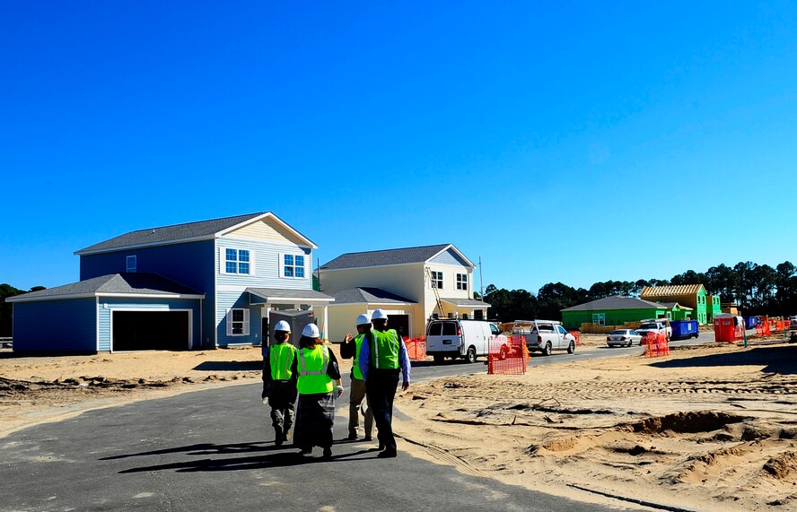 Construction workers give a tour of the work being completed in the Osprey Landing neighborhood at Hurlburt Field, Fla., Jan. 28, 2015. Various degrees of construction are under way, including finishing the interiors and framing houses. (U. S. Air Force photo/Airman 1st Class Andrea Posey)