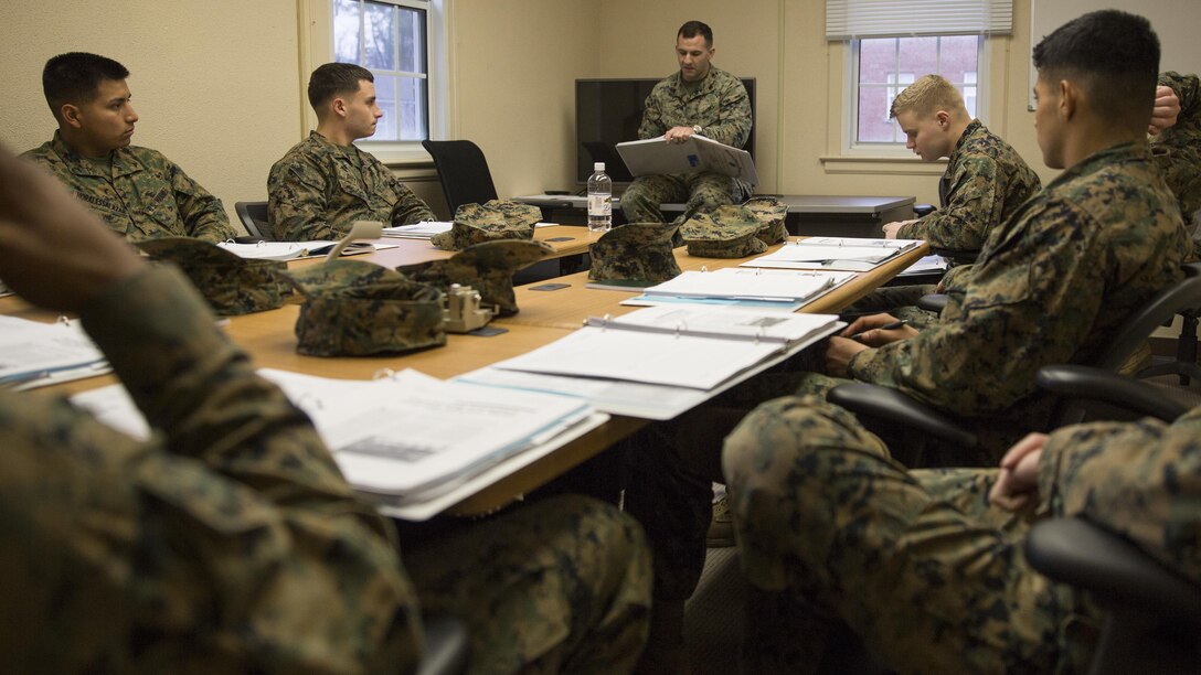 Marines attending the 10th Marine Regiment’s Lance Corporal Ethics and Leadership Seminar listen to their instructor, Sgt. Devin E. Greer, aboard Camp Lejeune, N.C., as he describes the qualities in a leader of Marines, Jan. 13, 2015. The instructor served as a guide while the Marines discussed what each of the qualities -- inspiration, technical proficiency, and moral responsibility -- meant to them. (U.S. Marine Corps photo by Lance Cpl. Olivia McDonald/Released)