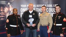 Capt. Joseph Haley, operations officer, RS Indianapolis, Staff Sgt Christian Harris and Sgt Richard Hayes, recruiters, RSS West Indy, honor Semper Fidelis Coaching Award winner Mark Bless, head football coach, Avon High School, Avon, IN, at the 2015 Glazier Coaches Clinics in Indianapolis Jan. 24. Coach Bless received the award for demonstrating the Marine Corps core values of honor, courage and commitment both on and off the football field.