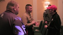 Capt. Joseph Haley, operations officer, RS Indianapolis, talks one-on-one with high school football coaches about the Marine Corps at 2015 Glazier Coaches Clinics in Indianapolis Jan. 24. 