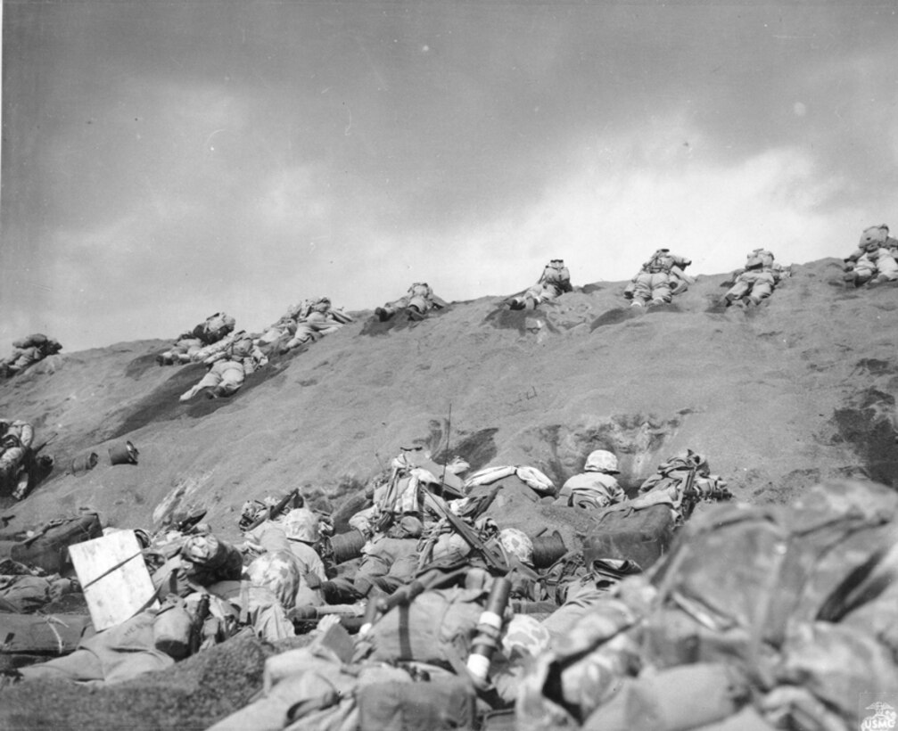 Fifth Division Marines crawl toward Mount Suribachi