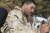 Sgt. Saddam Ahmad, an electrician with Combat Logistics Battalion 26, Headquarters Regiment, 2nd Marine Logistics Group, steps off with his Marines during a movement aboard U.S. Marine Corps Mountain Warfare Training at Bridgeport, California, Jan. 26, 2015. The Marines hiked roughly one mile towards their next objective, carrying only their essential gear, including ski poles, skis and snow shoes. (U.S. Marine Corps photo by Lance Cpl. Kaitlyn Klein/Released)