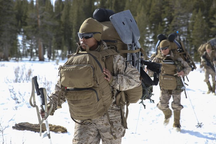 Cpl. Charlene Archuleta, an automotive maintenance technician with Combat Logistics Battalion 26, Headquarters Regiment, 2nd Marine Logistics Group, hikes with her Marines during a movement aboard U.S. Marine Corps Mountain Warfare Training Center at Bridgeport, California, Jan. 26, 2015. MWTC provides training that enhances a unit’s ability to sustain itself at high altitudes and in harsh climates. (U.S. Marine Corps photo by Lance Cpl. Kaitlyn Klein/Released)