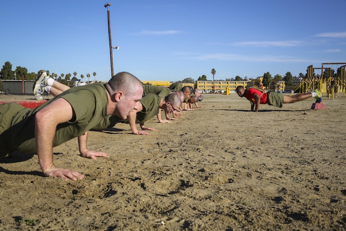 Recruits of Delta Company, 1st Recruit Training Battalion, perform decline pushups during interval training at Marine Corps Recruit Depot San Diego, Jan. 15.  Physical and mental training becomes an essential part in order to sustain a level of readiness.  