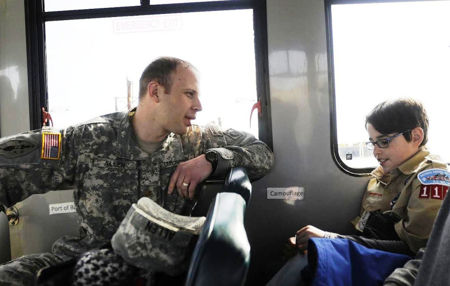Maj. Jason Allen, U.S. Army Corps of Engineers, Baltimore District, chats with a Cub Scout between various stops made during a tour of Poplar Island.  