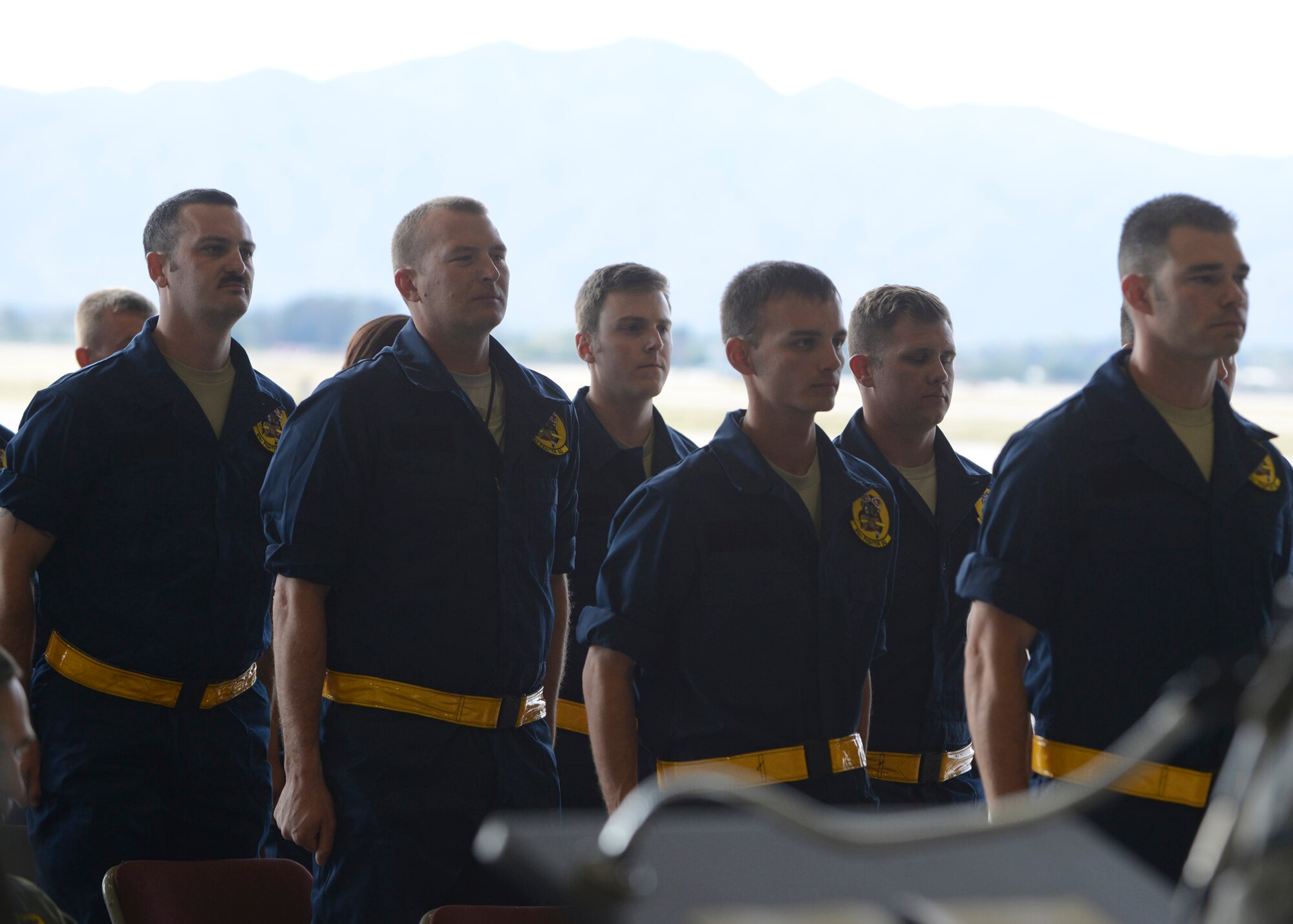 Members of the 61st Aircraft Maintenance Unit dedicated crew chiefs prepare to recite the Mechanic’s Creed during the recognition ceremony at Luke Air Force Base, Arizona, Jan. 23, 2015. Seventeen dedicated crew chiefs were each assigned to an F-35 Lightning II joint strike fighter. (U.S. Air Force photo/Senior Airman Devante Williams)