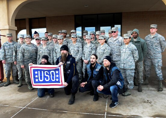 U.S. Air Force Air Commandos with the 27th Special Operations Wing gather for a group photo after breakfast with the Black Label Society outside the Pecos Trail Dining Facility Jan. 28, 2015 at Cannon Air Force Base, N.M. The band was afforded an opportunity to dine with recent award winners from around the wing before their tour of the installation. (U.S. Air Force photo/Airman 1st Class Shelby Kay-Fantozzi) 