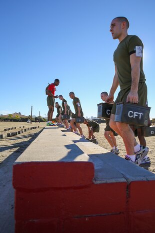 Recruits of Delta Company, 1st Recruit Training Battalion, perform step ups with ammunition cans during interval training at Marine Corps Recruit Depot San Diego, Jan. 15.  Recruits performed the exercises for a specific amount of time and then moved to the next station to perform the next exercise.