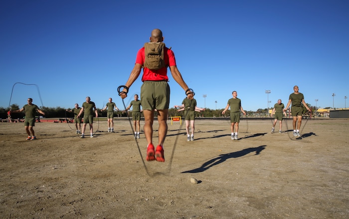 Staff Sgt. Jose A. Pinel, drill instructor, Delta Company, 1st Recruit Training Battalion, performs jump rope exercises with recruits during interval training at Marine Corps Recruit Depot San Diego, Jan. 15.  The Marine Corps uses interval training to help recruits gain physical endurance and to prepare them for upcoming challenges.
