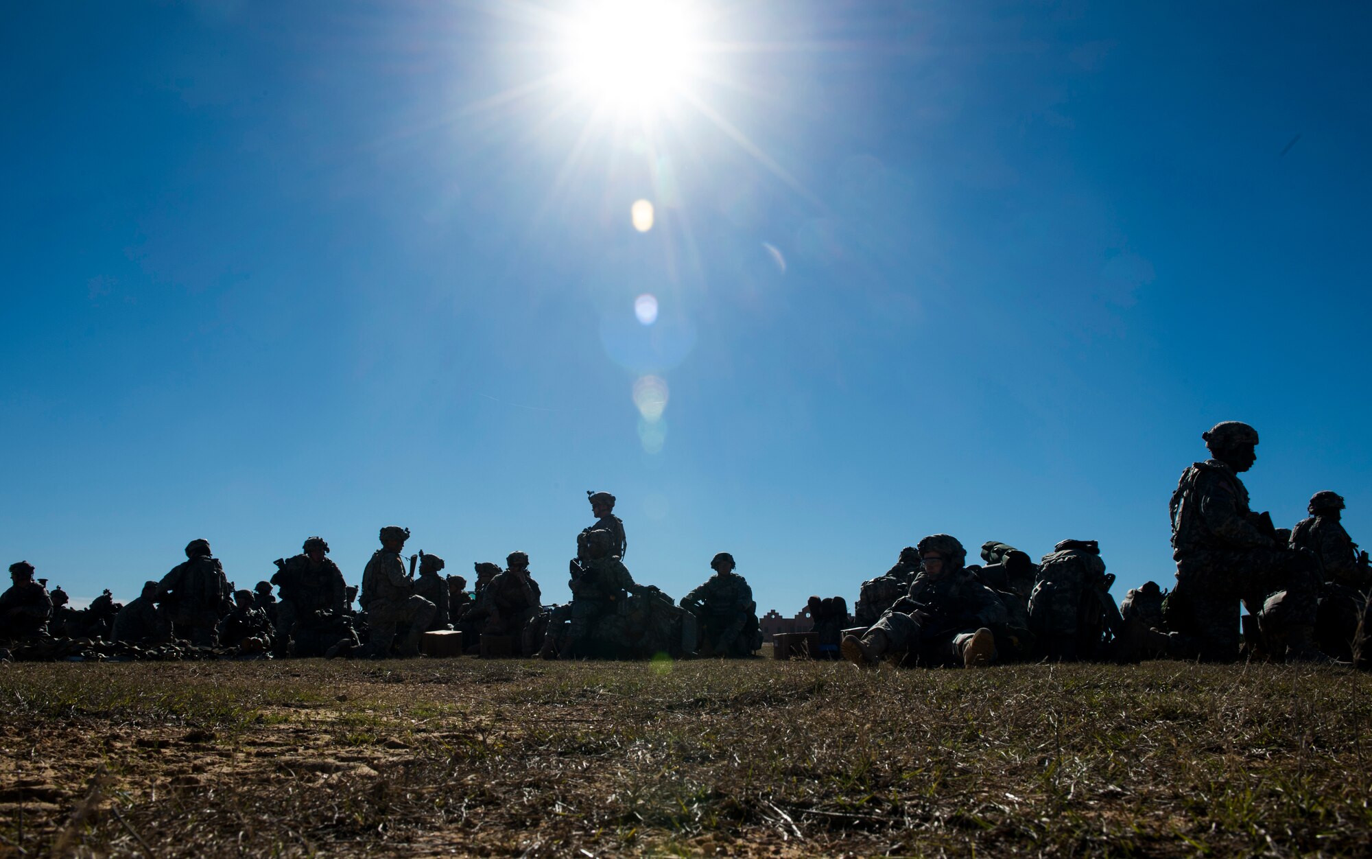 Members of the U.S. Army 1st Brigade 10th Mountain Division stationed at Fort Drum, N.Y., rest during an exercise at a the Joint Readiness Training Center at Fort Polk, La., Jan. 18, 2015. JRTC is a 34th Combat Training Squadron exercise for the U.S. Army that improves unit readiness by providing realistic, stressful, joint and combined arms training across the full spectrum of conflict. (U.S. Air Force photo/Staff Sgt. Gustavo Gonzalez/RELEASED)