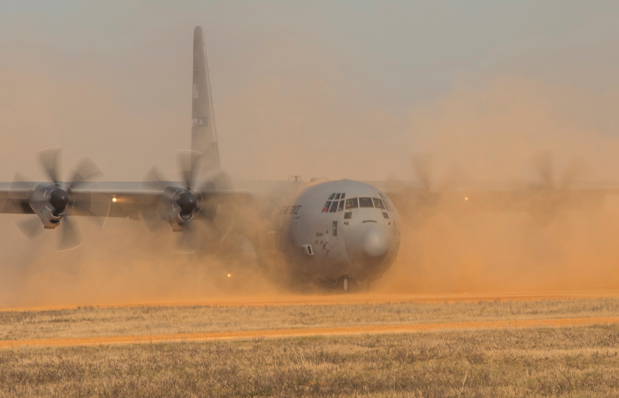 A U.S. Air Force C-130 Hercules lands during a training exercise at the Joint Readiness Training Center at Fort. Polk, La., Jan. 17, 2015. JRTC is a 34th Combat Training Squadron exercise for the U.S. Army that improves unit readiness by providing realistic, stressful, joint and combined arms training across the full spectrum of conflict. The Airmen helped support the exercise, and also provided an opportunity for internal training. (U.S. Air Force photo/Staff Sgt. Gustavo Gonzalez/RELEASED)