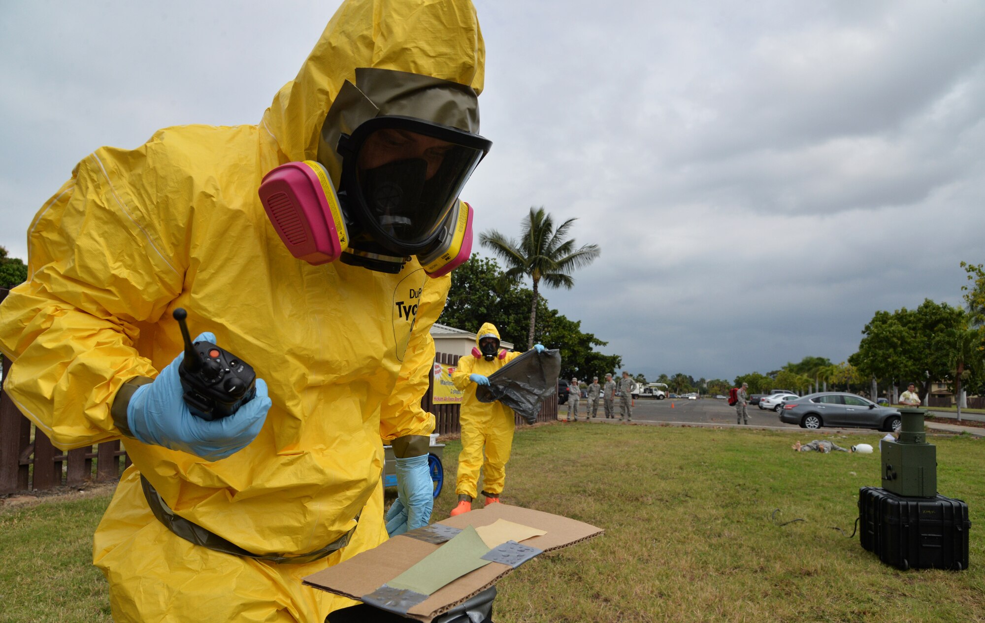 Staff Sgt. Ashley Dean (left), and Staff Sgt. Miriam Escobar, 15th Aerospace Medical Squadron bioenvironmental engineering flight, check hazardous compound detection equipment in a simulated contaminated area during integrated base emergency response capability training Jan. 30, 2015, at Joint Base Pearl Harbor-Hickam, Hawaii. The bioenvironmental engineering flight participated in the training Jan. 26-30. (U.S. Air Force photo by Staff Sgt. Alexander Martinez)