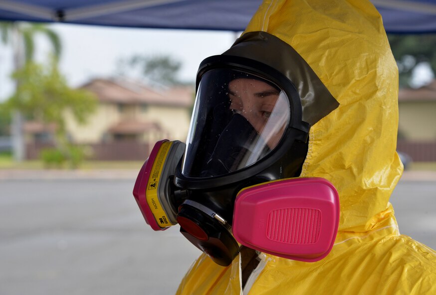 Staff Sgt. Ashley Dean, 15th Aerospace Medical Squadron bioenvironmental engineering flight, prepares to enter a simulated contaminated zone in order to conduct hazardous material testing during integrated base emergency response capability training Jan. 30, 2015, at Joint Base Pearl Harbor-Hickam, Hawaii. The bioenvironmental engineering flight participated in the training Jan. 26-30. (U.S. Air Force photo by Staff Sgt. Alexander Martinez) 