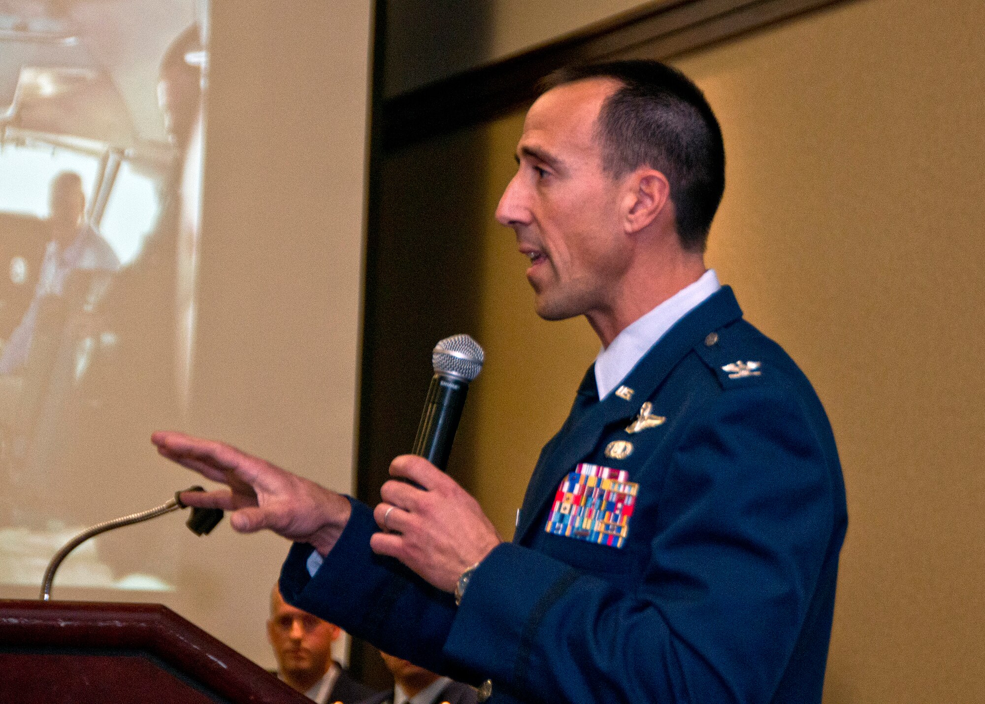 Col. Leonard Kosinski, 60th Air Mobility Wing vice commander, speaks Jan. 22 during the Honorary Commander induction ceremony at the Delta Breeze Club at Travis Air Force Base, California. Professionals from 23 businesses and partners in the community were inducted. (U.S. Air force photo by T.C. Perkins Jr.)