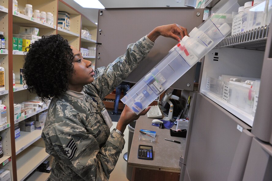 Tech. Sgt. Shontell Nelson, 341st Medical Support Squadron pharmacy flight chief, selects a bottle from the Malmstrom Air Force Base, Mont., pharmacy’s Pyxis CII Safe narcotics vault as she fills a prescription Jan. 26. The new safe automatically tracks the pharmacy’s inventory of controlled substances. (U.S. Air Force photo/John Turner)