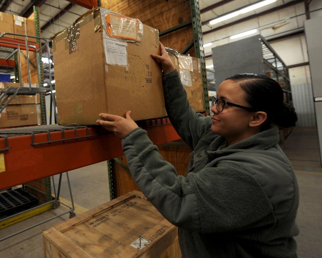 U.S. Air Force Staff Sgt. Marilyn Torres Rivera, 7th Logistic Readiness Squadron B-1 Aircraft Parts Store, assistant noncommissioned officer in charge, consolidates shelving space during a large parts transition Jan. 8, 2015, at Dyess Air Force Base, Texas. Torres Rivera assisted in every part of the parts transition from the APS warehouse to the main logistics warehouse. (U.S. Air Force photo by Airman 1st Class Alexander Guerrero/Released)