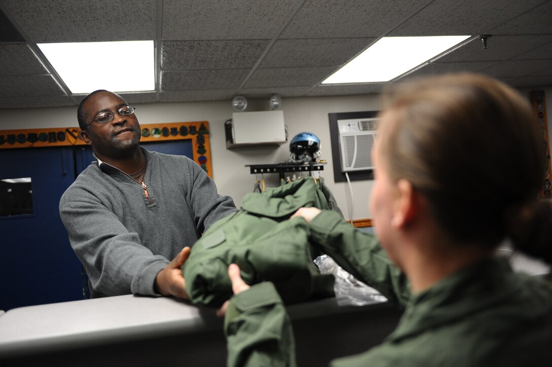 Willie Crawford, 14th Logistics Readiness Squadron Material Specialist, issues an upcoming student pilot flight equipment Jan. 27 on Columbus Air Force Base, Miss. 14th LRS Material Management Flight also handles the equipment that is needed for Airmen who are deploying. (U.S. Air Force photo/Airman Daniel Lile)