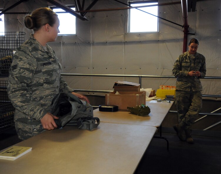 Oregon Air National Guard Staff Sgt. Stephanie Glidewell and Senior Airman Shasta Petersen, both of the 173rd Fighter Wing Logistics Readiness Squadron, inventory equipment recently returned to the supply warehouse at Kingsley Field, Ore. Jan. 28, 2015.  As a materials manager Glidewell and Petersen are responsible for managing, administrating, and operating supply systems and activities in order to provide the necessary equipment and supplies for base operations. (U.S. Air National Guard photo by Tech. Sgt. Daniel J. Condit/released)