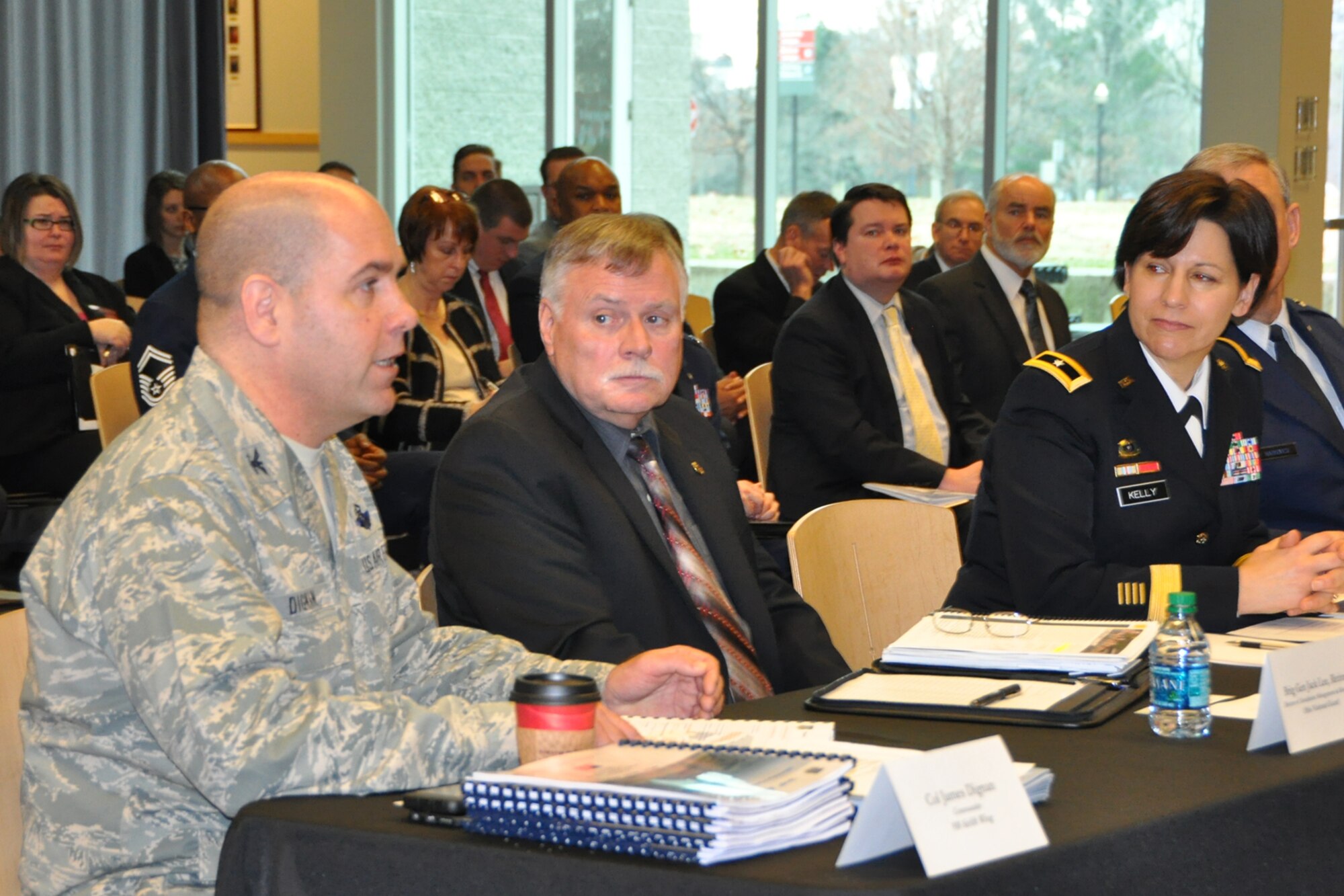 COLUMBUS, Ohio – Air Force Reserve Col. James Dignan, commander of the 910th Airlift Wing based at Northeast Ohio’s Youngstown Air Reserve Station, briefs a panel of Ohio congressional representatives about the wing’s mission and capabilities at a meeting in the Nationwide & Ohio Farm Bureau 4-H Center Bob Evans Memorial Auditorium here, Jan. 23, 2015. Brig. Gen. (ret.) Jack Lee, Director of Ohio National Guard Installation Management and Resources, and Brig. Gen. Maria Kelly, Deputy to the Ohio 
National Guard Assistant Adjutant General for Army, as well as an audience of invited guests listen to the 910th commander’s comments. Dignan and other leaders from Ohio’s Department of Defense (DoD) facilities and organizations were invited by the congressional panel to participate in a discussion intended to give the delegation a better understand of the status, the missions and importance of the various DoD assets located across the state. U.S. Air Force photo by Master Sgt. Bob Barko Jr.
