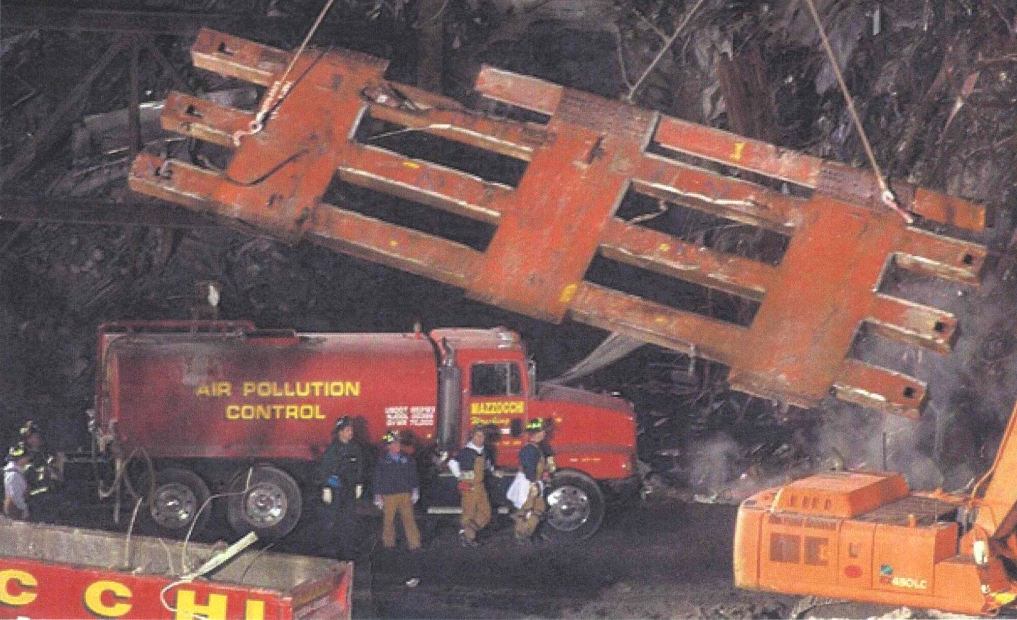 Chief Master Sgt. Ken Koyles’ brother, David Koyles, one of the few surviving New York City firefighters following Sept. 11, 2001 (in white sleeves with crossed legs) leans against a truck near the world trade center. (Photo submitted by Chief Master Sgt. Koyles)