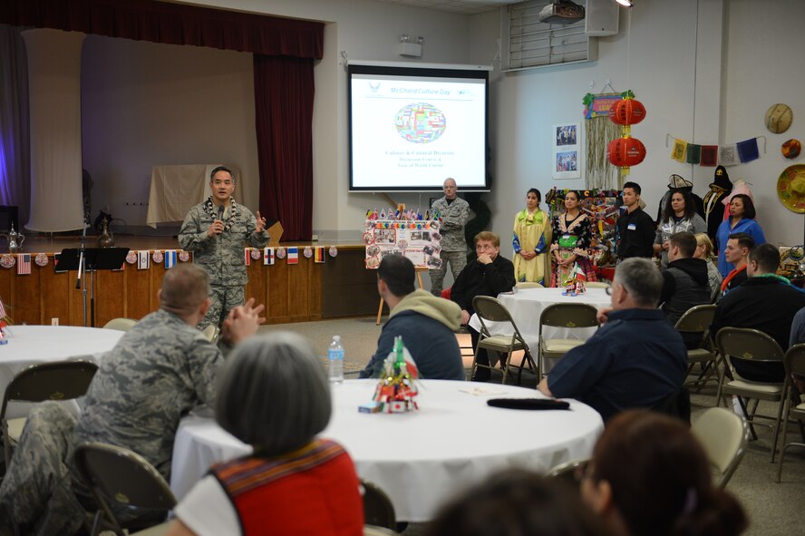 Col. David Kumashiro (center), 62nd Airlift Wing commander, gives a speech to the Culture Day attendees Jan. 23, 2015, during Culture Day at Joint Base Lewis-McChord, Wash. During Culture Day, Airmen were able to look at booths with posters containing information on different cultures and talk to volunteers about their booths. (U.S. Air Force photo/Airman 1st Class Keoni Chavarria)