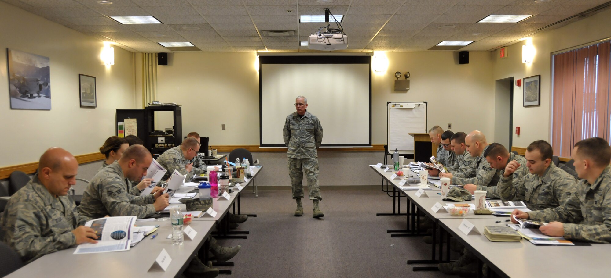 Chief Master Sgt. Mark Schaible talks about the 109th Airlift Wing's history during the wing's first Airman Development Course at Stratton Air National Guard Base, N.Y., on  Jan. 30, 2015. 14 Airmen throughout the base took the three-day course Jan. 28-30, 2015. Along with the wing's history, the course covered topics on public speaking, Air Force heritage, teambuilding, conflict resolution, the evaluation process, financial and educational benefits, and more. (U.S. Air National Guard photo by Tech. Sgt. Catharine Schmidt/Released)