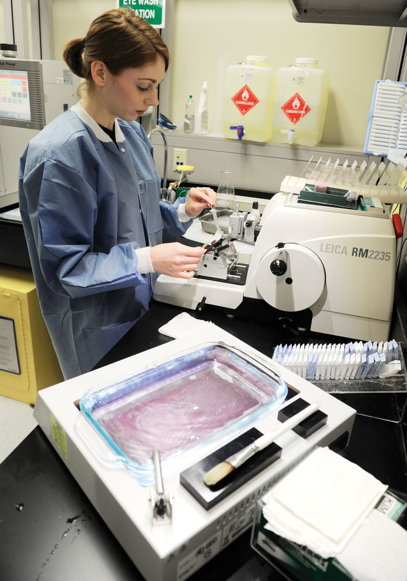 Senior Airman Taylor Davis, 673d Medical Support Squadron histology technician, cuts tissue on a microtome prior to applying it to a slide in a laboratory Jan. 19. Histopathology is just one part of the Air Force’s Biomedical Sciences Corps, which turns 50 this year. (U.S. Air Force photo/Staff Sgt. Wes Wright)