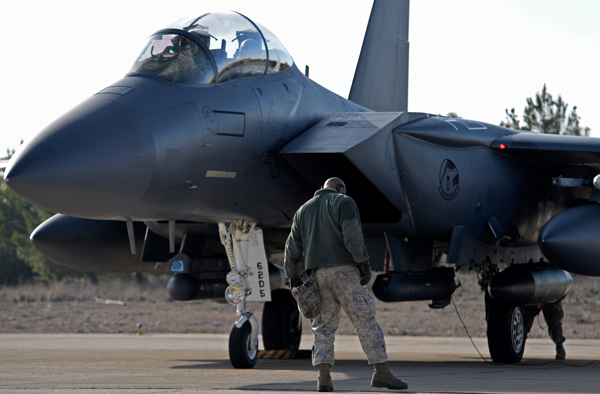 A 492nd Aircraft Maintenance Unit Airman prepares to launch an F-15E Strike Eagle at Los Llanos Air Base, Spain, Jan. 29, 2015. The 492nd Fighter Squadron left Spain upon the cancelation of Tactical Leadership Programme 2015-1, a NATO exercise that develops leadership and interoperability amongst allies.  The training event was cut short after 11 airmen from the Greek and French air forces lost their lives following an aircraft crash. (U.S. Air Force photo by Airman 1st Class Erin R. Babis/Released)