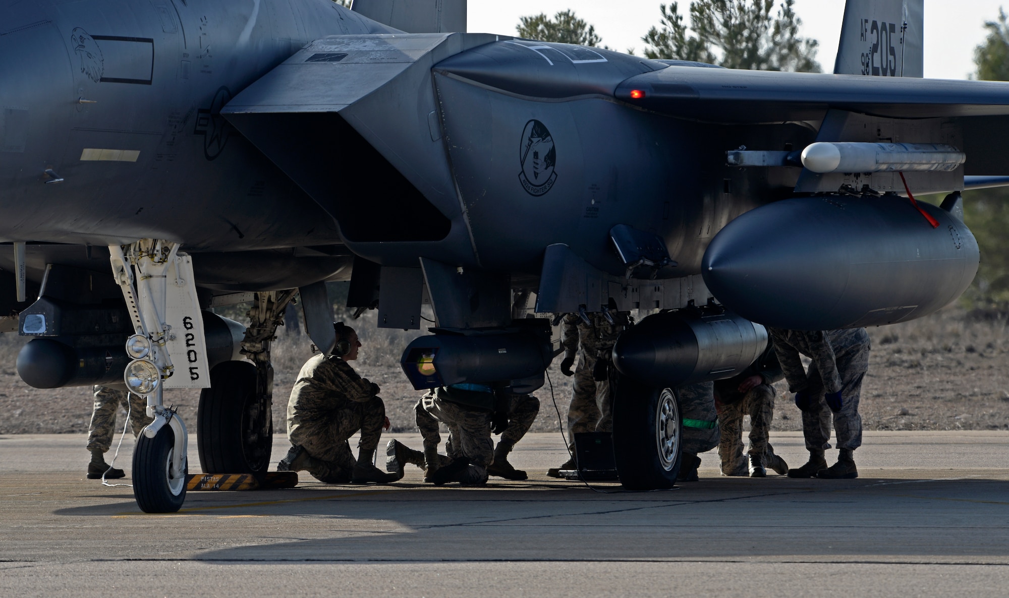 Liberty Airmen from the 492nd Aircraft Maintenance Unit respond to a request from the pilot to check the fuel system prior to take-off at Los Llanos Air Base, Spain, Jan. 29, 2015. The 492nd Fighter Squadron returned to their home station, Royal Air Force Lakenheath, United Kingdom, after 11 airmen from the Greek and French air forces lost their lives following an aircraft crash at Tactical Leadership Programme 2015-1, a NATO exercise that develops leadership and interoperability amongst allies. (U.S. Air Force photo by Airman 1st Class Erin R. Babis/Released)