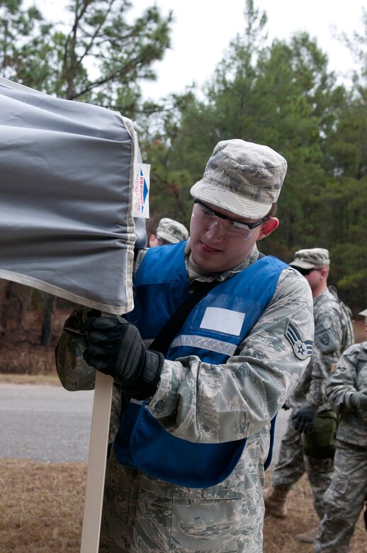 Air Force Senior Airman Jacob Blevins, a member of the Kentucky National Guard CERFP hot zone triage team, assembles a medical tent during Operation Starke Thunder at Camp Blanding in Starke, Fla., Jan. 12, 2015. The four-day exercise certified the joint Kentucky Army and Air Guard emergency-response team as mission-ready. (U.S. Air National Guard photo by Staff Sgt. Vicky Spesard)