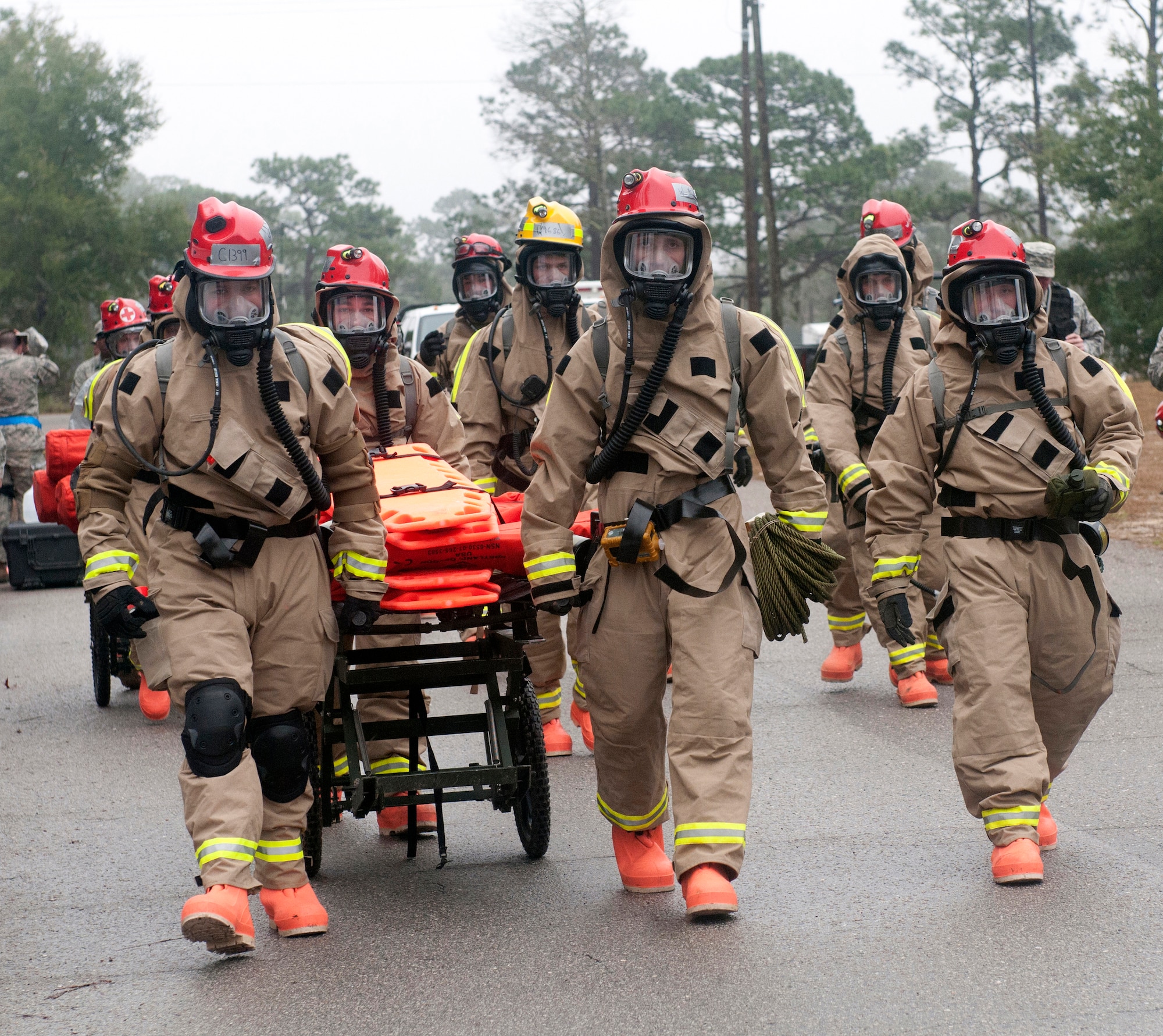 Members of the Kentucky National Guard CERFP head toward a simulated hot zone to conduct search-and-extraction operations during Operation Starke Thunder at Camp Blanding in Starke, Fla., Jan. 13, 2015. The four-day exercise certified the joint Kentucky Army and Air Guard emergency-response group as mission-ready. (U.S. Air National Guard photo by Staff Sgt. Vicky Spesard)