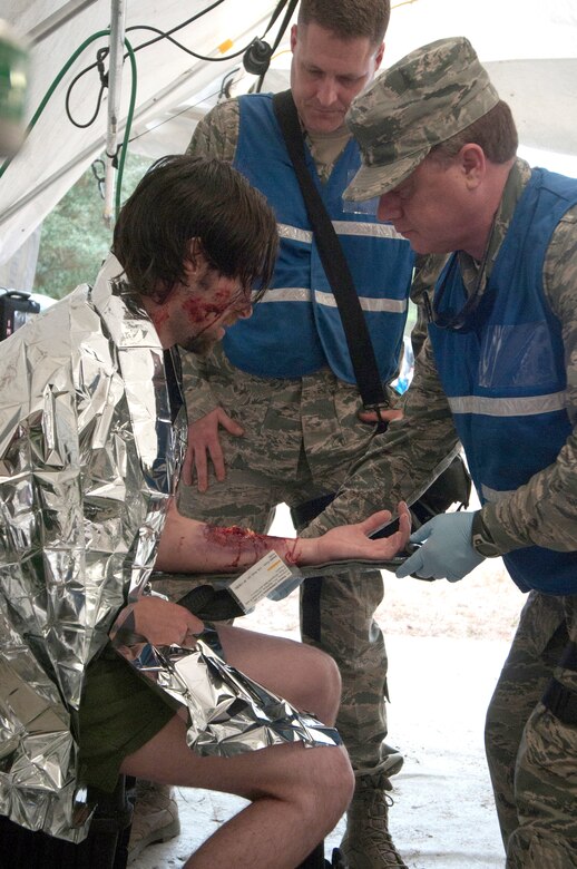 Airmen from the Kentucky National Guard CERFP’s medical element evaluate the simulated injuries of a patient during Operation Starke Thunder at Camp Blanding in Starke, Fla., Jan. 13, 2015. The four-day exercise certified the joint Kentucky Army and Air Guard emergency-response team as mission-ready. (U.S. Air National Guard photo by Staff Sgt. Vicky Spesard)