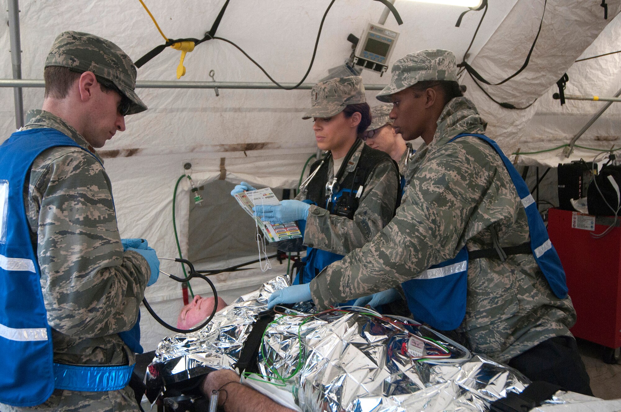 Airmen from the Kentucky National Guard CERFP’s medical element evaluate the simulated injuries of a patient during Operation Starke Thunder at Camp Blanding in Starke, Fla., Jan. 13, 2015. The four-day exercise certified the joint Kentucky Army and Air Guard emergency-response team as mission-ready. (U.S. Air National Guard photo by Staff Sgt. Vicky Spesard)