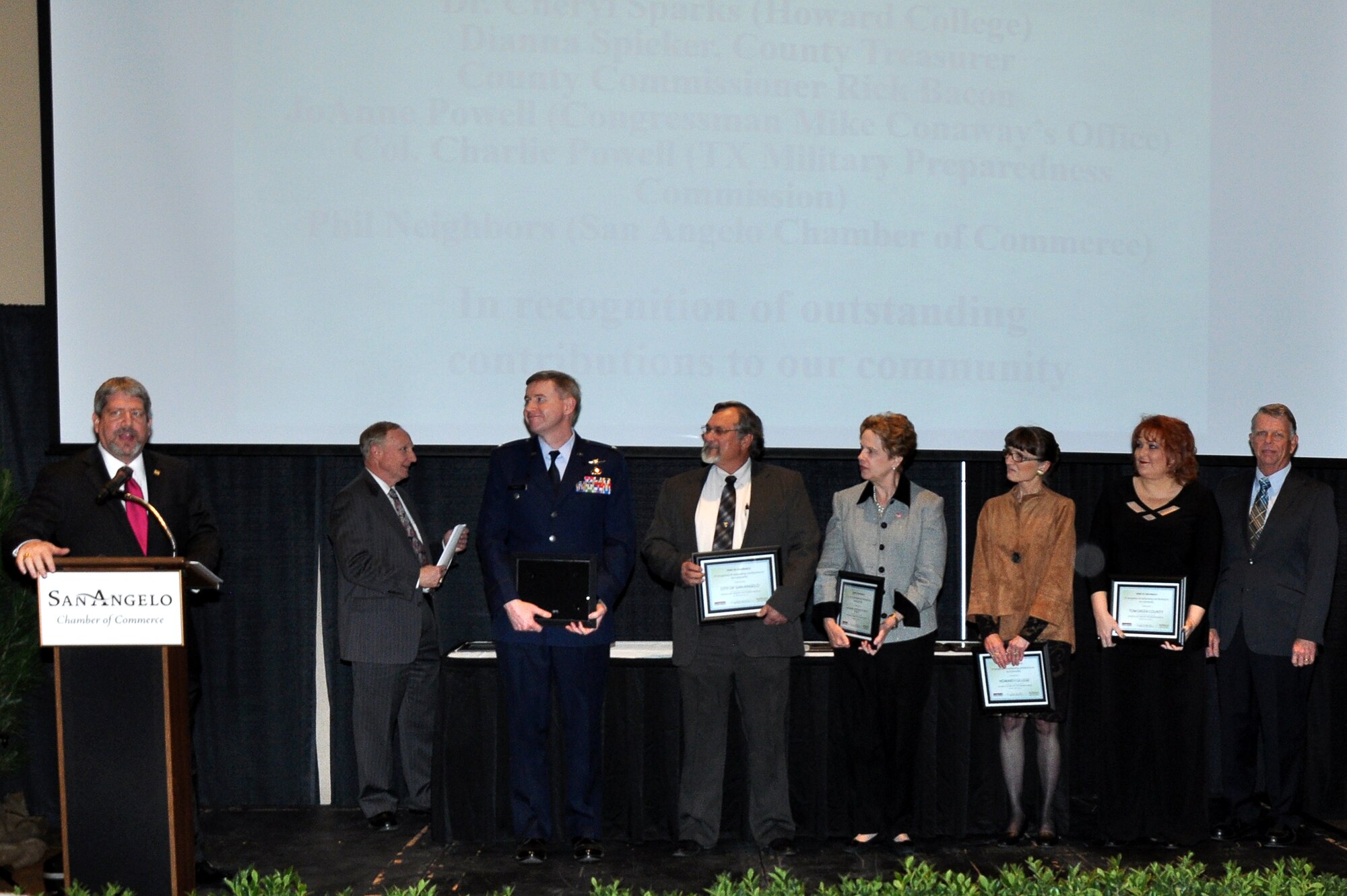 SAN ANGELO, Texas - Several local leaders stand with their Spirit of San Angelo Award during the San Angelo Chamber of Commerce Annual Banquet at the McNease Convention Center Jan. 29. These local leaders received this award for their efforts in the community partnership helping save Goodfellow Air Force Base and San Angelo money. (U.S. Air Force photo/ Senior Airman Joshua Edwards)
