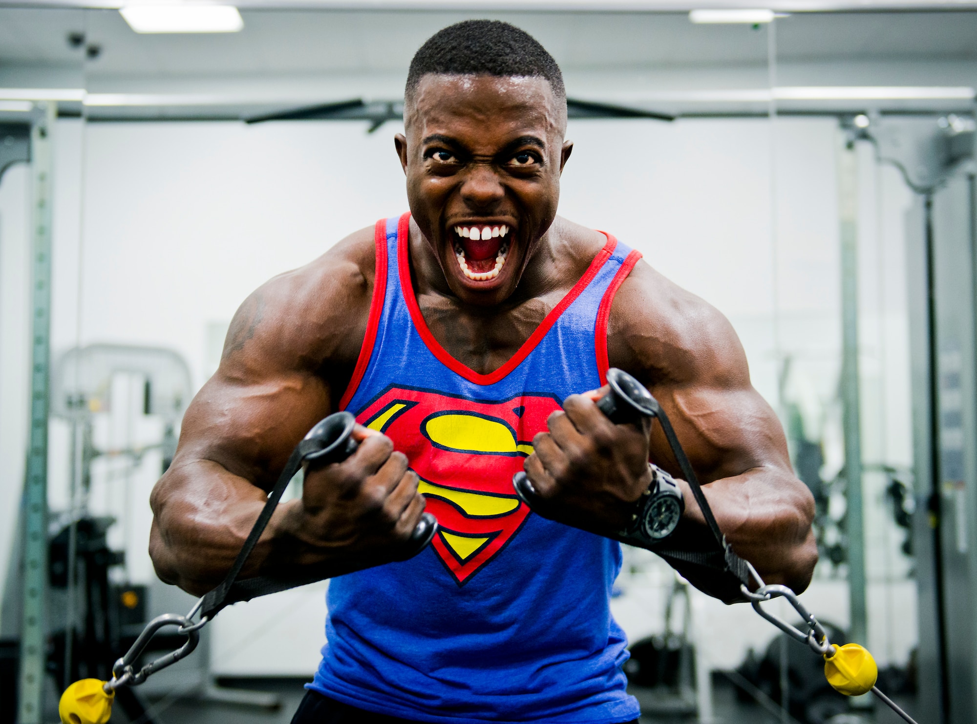 Senior Airman Terrence Ruffin, 16th Electronic Warfare Squadron, strains for an extra rep on a weight machine at the fitness center on Eglin Air Force Base, Fla.  In November, the Airman became the youngest professional bodybuilder on the circuit at age 21.  (U.S. Air Force photo/Samuel King Jr.)