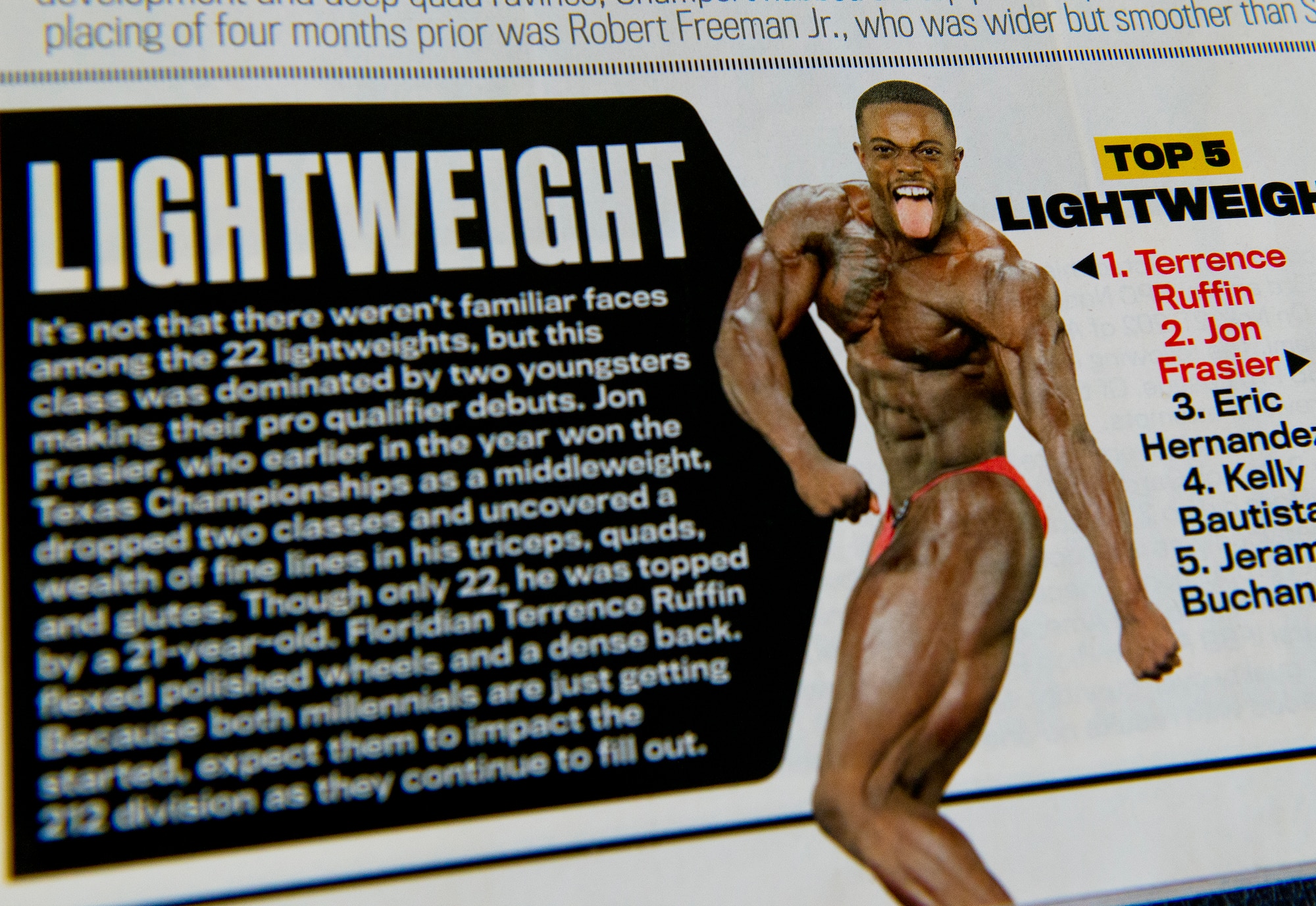 Senior Airman Terrence Ruffin, 16th Electronic Warfare Squadron, reviews an issue of "Flex" magazine featuring a write up about his success at a young age.  In November, the Airman became the youngest professional bodybuilder on the circuit at age 21.  (U.S. Air Force photo/Samuel King Jr.)