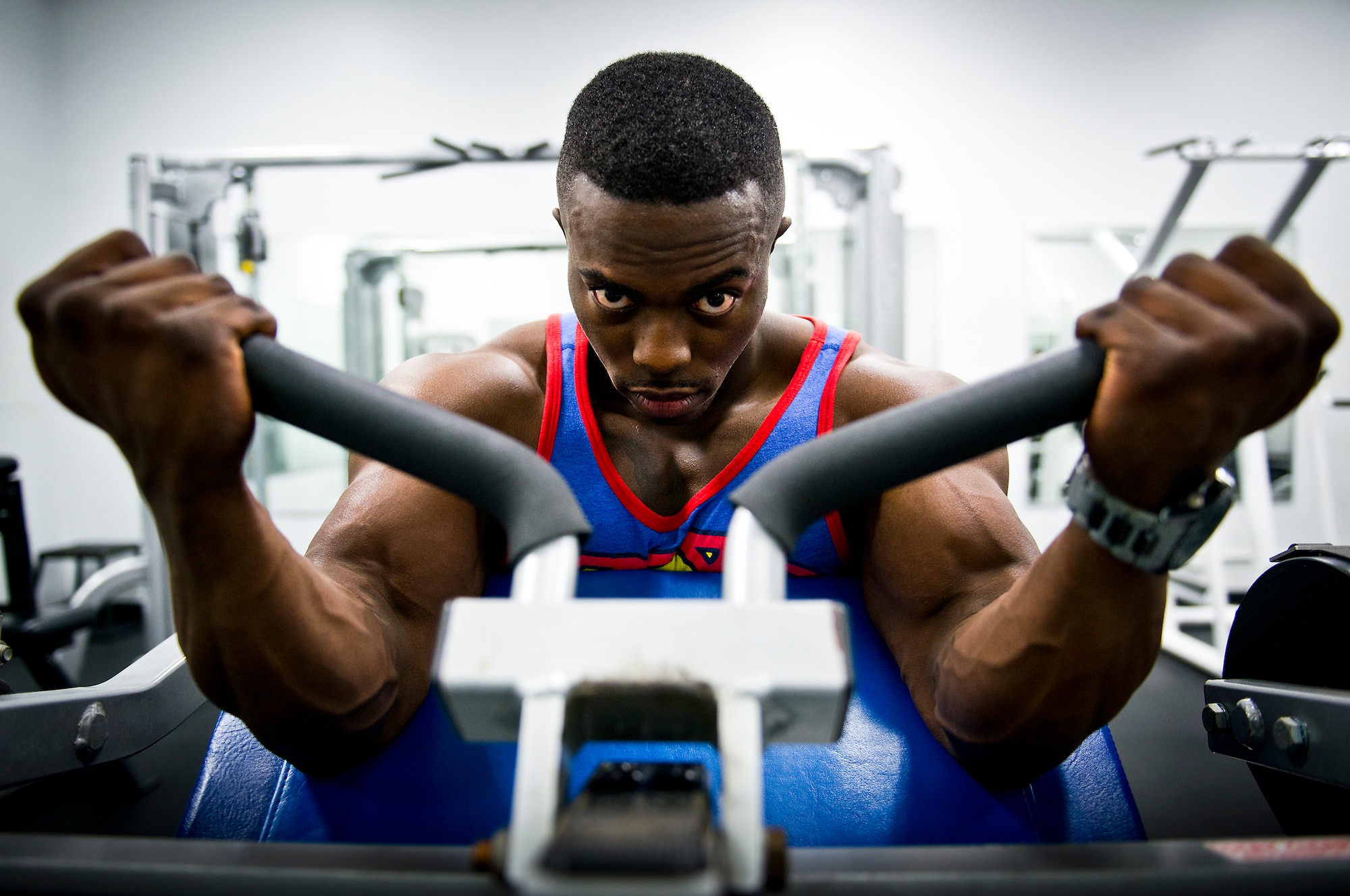 Senior Airman Terrence Ruffin, 16th Electronic Warfare Squadron, lifts weights at the fitness center on Eglin Air Force Base, Fla.  In November, the Airman became the youngest professional bodybuilder on the circuit at age 21.  (U.S. Air Force photo/Samuel King Jr.)