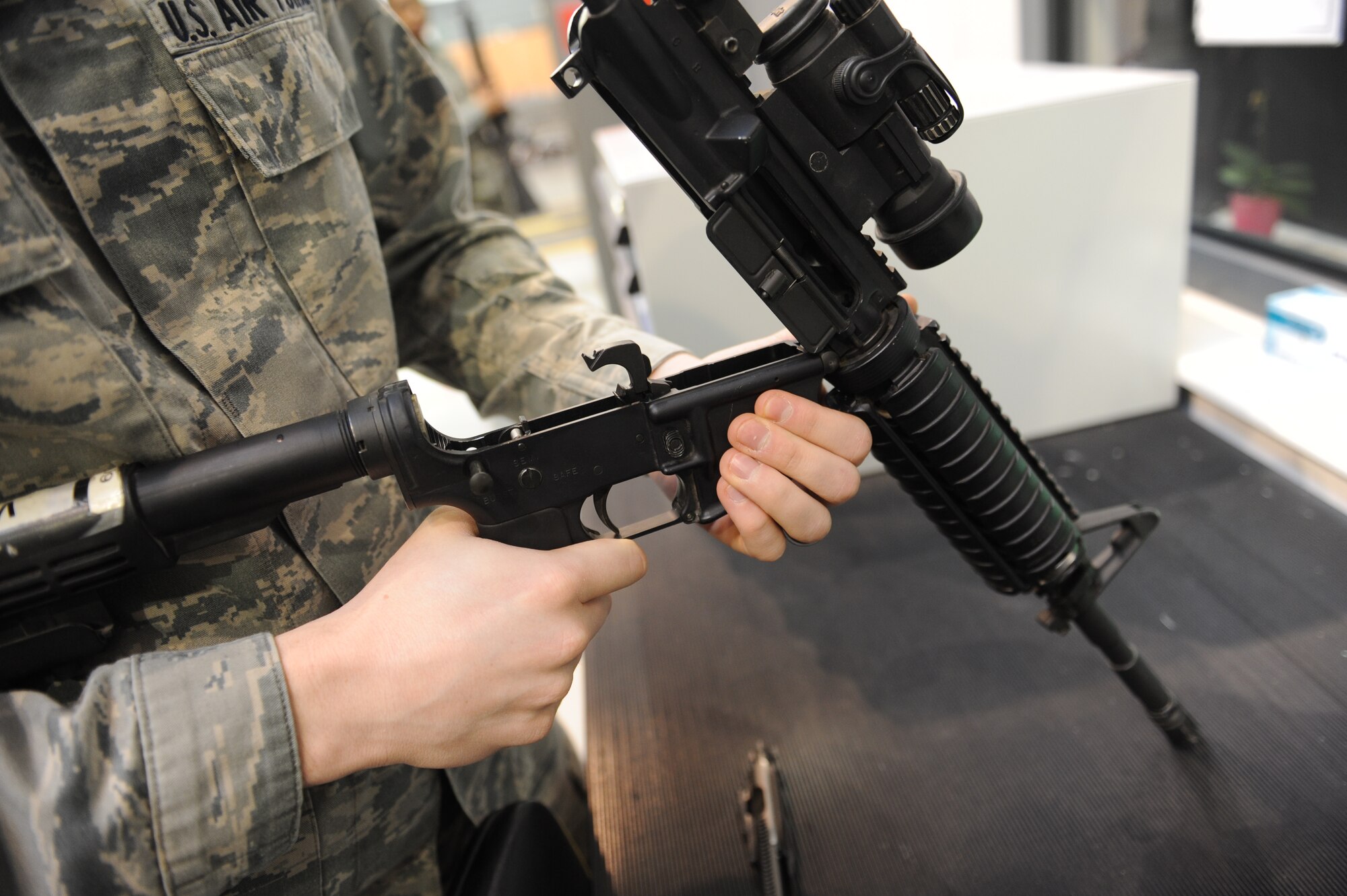Senior Airman Chris Curry, 86th Logistics Readiness Squadron armory journeyman, checks the inside of an M-16 rifle on Ramstein Air Base, Germany, Jan. 28, 2015. In 2014, the individual protective equipment team won 86th Airlift Wing Innovator of the Month for October. Their innovation was the installation of a $244,000 Mechanized Material Handling System, saving the Air Force roughly 720 man-hours per year. (U.S. Air Force Photo/Airman 1st Class Michael Stuart)