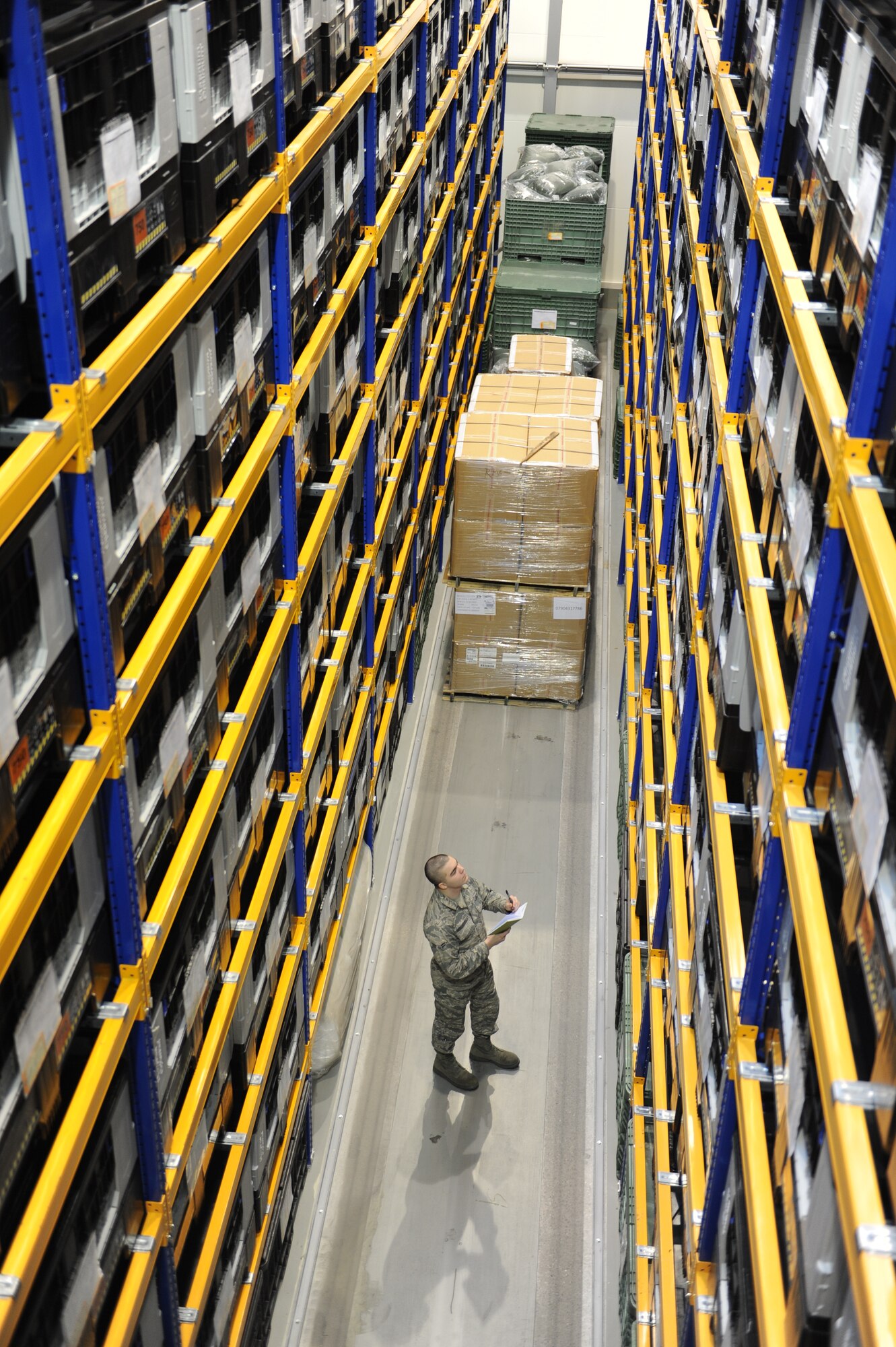 Airman 1st Class Alexander Hershberger, 86th Logistics Readiness Squadron individual protective equipment apprentice, takes inventory of storage bins on Ramstein Air Base, Germany, Jan. 28, 2015. On an average week, the IPE team processes around 130 to 150 service member’s individual protective gear, ranging from bases all over U.S. Air Forces in Europe and Air Forces Africa. (U.S. Air Force Photo/Airman 1st Class Michael Stuart) 