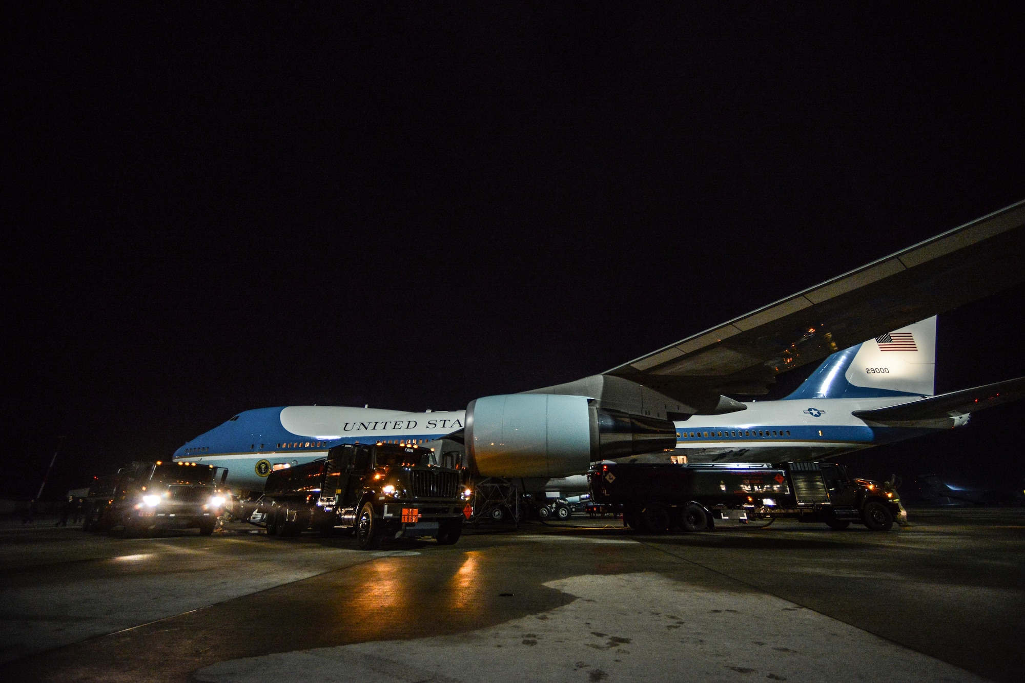 Fuel trucks are park next to Air Force One while Airmen assigned to the 86th Logistics Readiness Squadron refuel the aircraft on Ramstein Air Base, Germany, Jan. 27, 2015.  The 86th LRS Airmen pumped about 500,000 pounds of fuel into the aircraft in a little more than an hour which is a record-time for the fuels team. (U.S. Air Force photo/Senior Airman Nicole Sikorski)