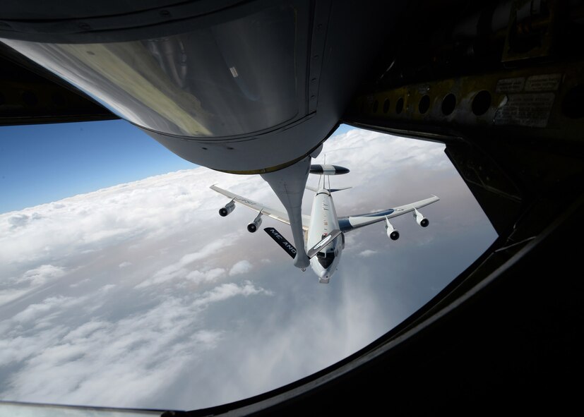 A U.S. Air Force E-3 “Sentry” Airborne Warning and Control System aircraft from Tinker Air Force Base approaches a KC-135 “Stratotanker” from the Maine Air National Guard during refueling operations over Iraq on Oct. 2, in support of operations against ISIL/ISIS targets. The AWACS provides situational awareness of friendly, neutral and hostile activity, command and control of an area of responsibility, battle management of theater forces, all-altitude and all-weather surveillance of the battle space, and early warning of enemy actions during joint, allied and coalition operations. (Air Force photo by Staff Sgt. Shawn Nickel)