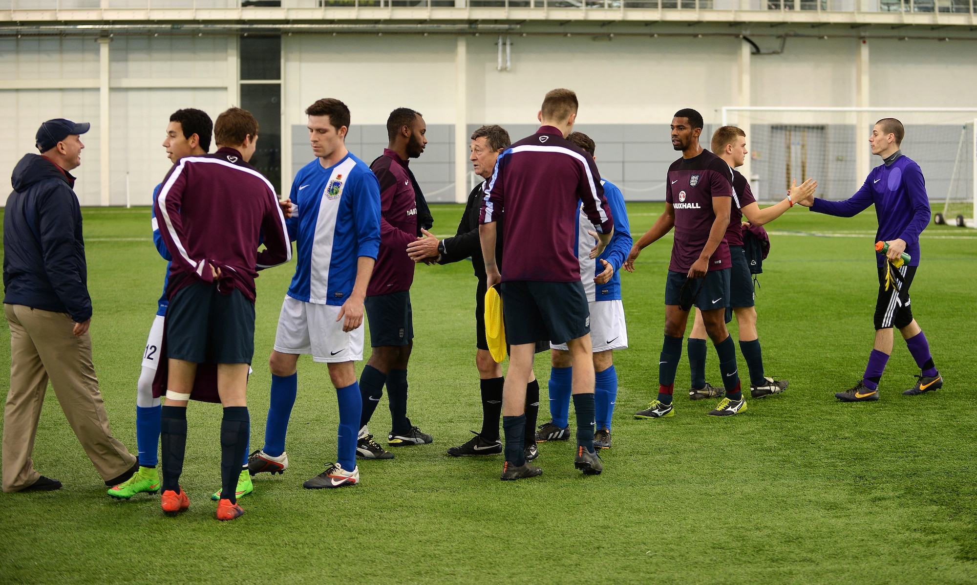 Members of the Liberty Football Club and the world-ranked England Cerebral Palsy team congratulate each other after a match at St. George’s Park, England, Jan. 25, 2015. This match highlighted the continued cooperation and relationship between the U.K. and the U.S. (U.S. Air Force photo by Staff Sgt. Emerson Nuñez/Released)