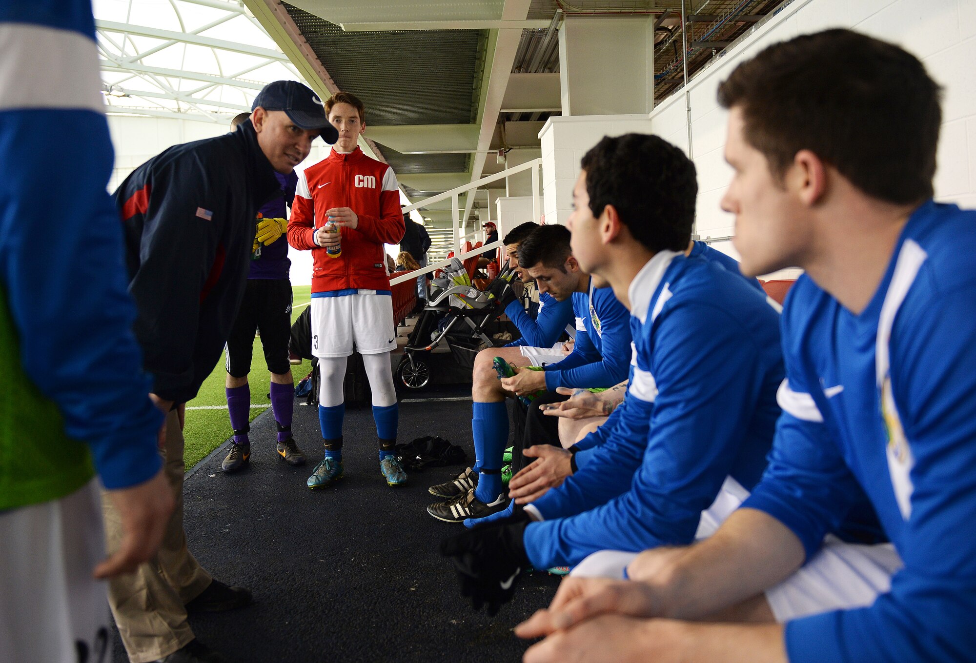 Lt. Col. Derrick Weyand, head coach for the Liberty Football Club, discusses strategies for the second half of the game during a match against the world-ranked England Cerebral Palsy team at St. George’s Park, England, Jan. 25, 2015. Active duty members, dependents and high school students are welcome to join the Liberty Football Club. (U.S. Air Force photo by Staff Sgt. Emerson Nuñez/Released)
