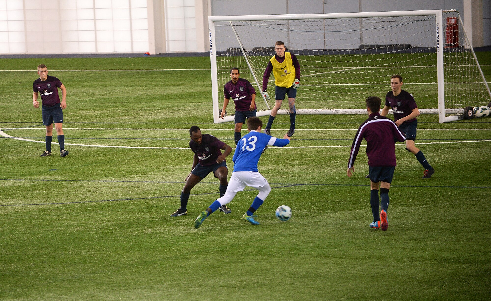 Christopher Miles, a midfielder for the Liberty Football Club, advances past defenders during a match against the world-ranked England Cerebral Palsy team at St. George’s Park, England, Jan. 25, 2015. The England CP team is currently training for the 2015 CP World Cup, which will be hosted by England at St. George’s Park. (U.S. Air Force photo by Staff Sgt. Emerson Nuñez/Released)