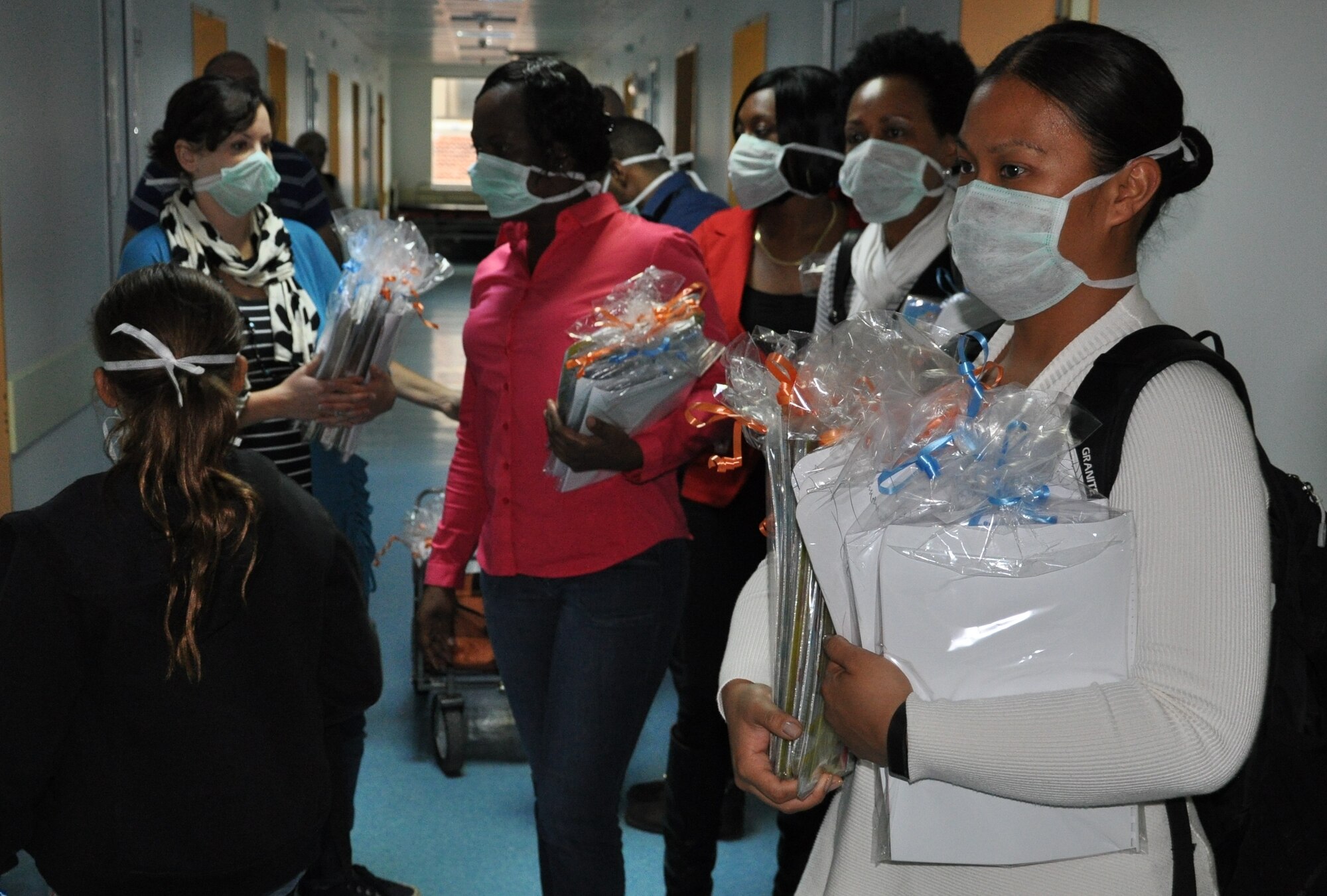 Members of the 425th Air Base Squadron and NATO as well as volunteers hand out children’s books, coloring books, colored pencils, crayons and puzzles to more than 100 children at a local children’s hospital during  a community outreach Jan. 23, 2015, at Izmir, Turkey. The community prepared for about a month for the outreach collecting more than 300 gift items that were delivered along with the donations made by the 425th ABS and NATO service members. (U.S. Air Force photo by Tanju Varlıklı/Released)
