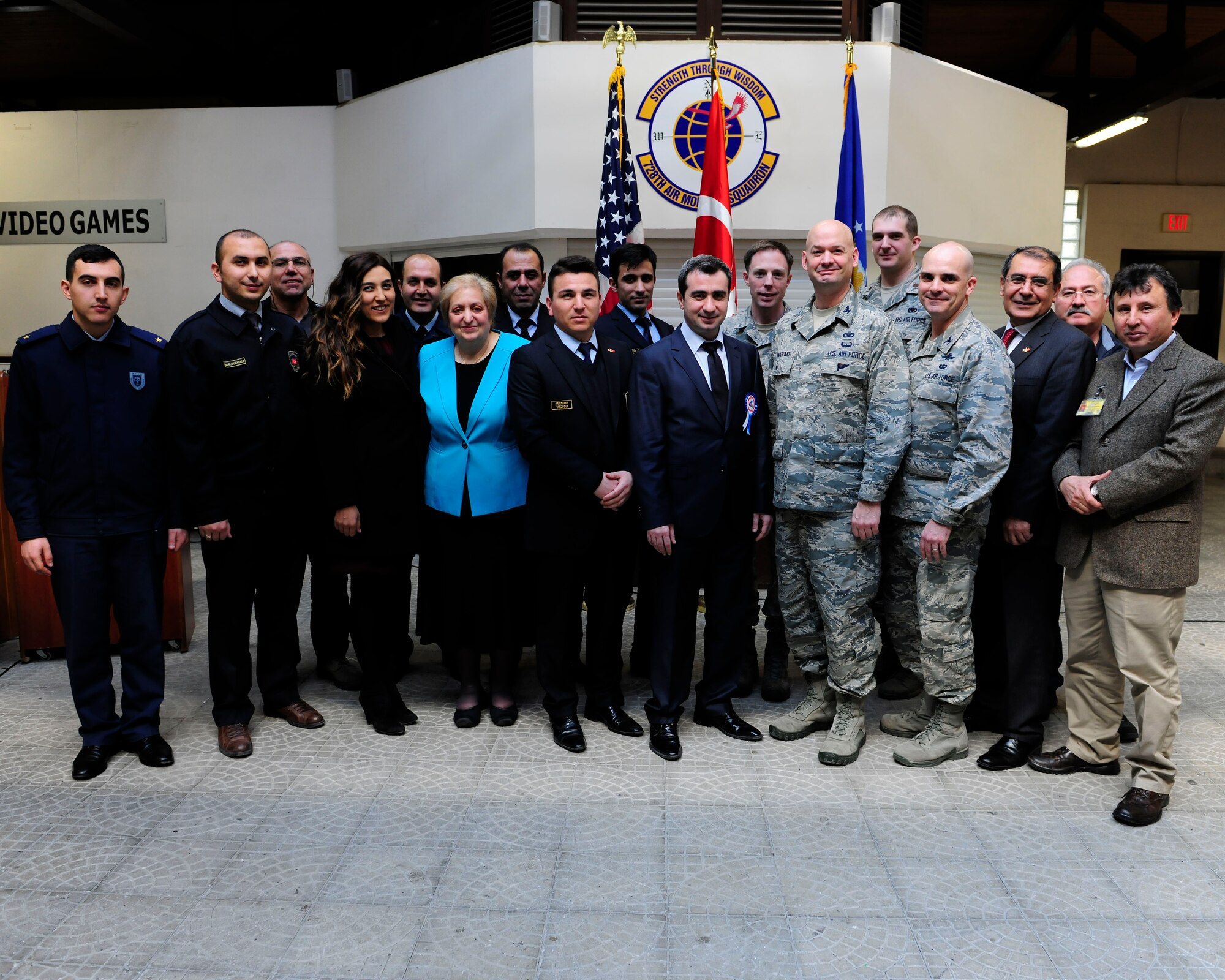 Members from the 39th Air Base Wing and Ministry of Customs and Trade customs agents pose for a photo during the first-ever International Customs Day luncheon Jan. 26, 2015, at Incirlik Air Base, Turkey. The theme of this year’s International Customs Day was “Coordinated Border Management.” (U.S. Air Force photo by Senior Airman Krystal Ardrey/Released)